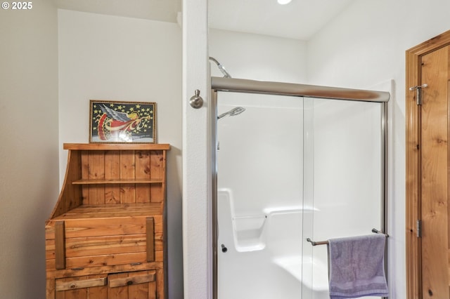 bathroom featuring a shower stall