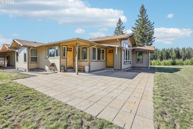 52135 E Terra Fern Dr, Sandy, OR 97055 - back of house featuring a lawn