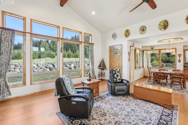 52135 E Terra Fern Dr, Sandy, OR 97055 - living area featuring wood finished floors, high vaulted ceiling, a chandelier, ceiling fan, and beamed ceiling