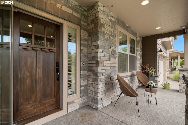 doorway to property featuring covered porch