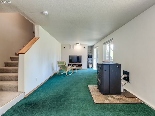 118 Marian Ln, Ariel, WA 98603 - living area featuring a wood stove, carpet, stairs, and a textured ceiling