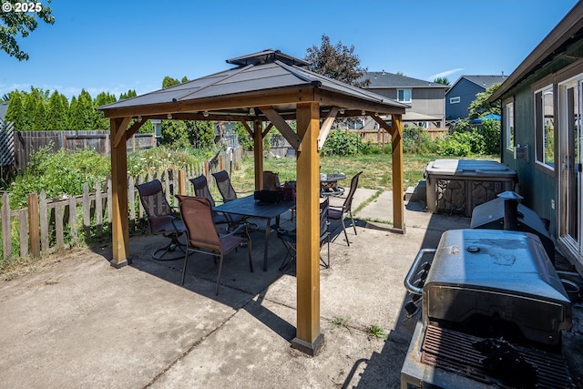 1280 Peets Ct, Eugene, OR 97402 - fenced backyard featuring a gazebo, a patio area, outdoor dining space, a jacuzzi, and grilling area