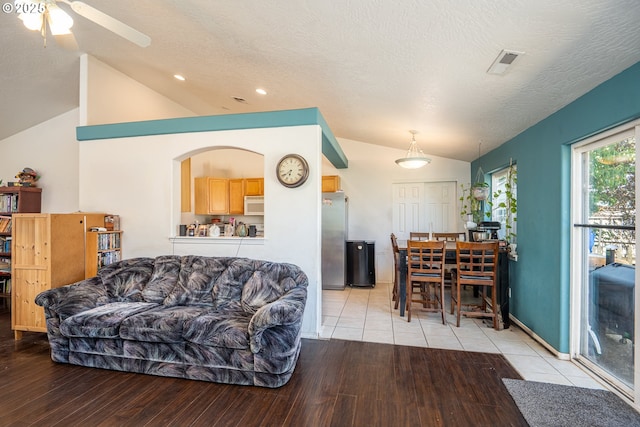 1280 Peets Ct, Eugene, OR 97402 - living room featuring lofted ceiling, light wood-type flooring, a ceiling fan, a textured ceiling, and recessed lighting