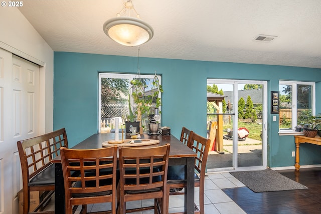 1280 Peets Ct, Eugene, OR 97402 - tiled dining space with plenty of natural light and a textured ceiling