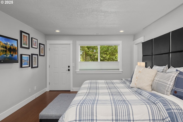 48 Eagle Crest Dr Unit 4A, Lake Oswego, OR 97035 - bedroom featuring dark wood finished floors, baseboards, recessed lighting, and a textured ceiling