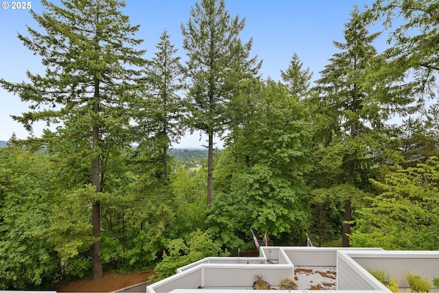 48 Eagle Crest Dr Unit 4A, Lake Oswego, OR 97035 - view of yard featuring a balcony and a forest view