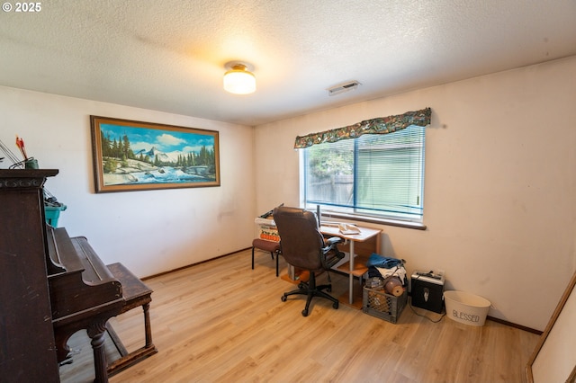 1630 SW Riverhill Dr, Hermiston, OR 97838 - office featuring wood finished floors, a textured ceiling, and baseboards
