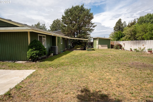 1630 SW Riverhill Dr, Hermiston, OR 97838 - view of yard featuring central air condition unit, a shed, and an outdoor structure
