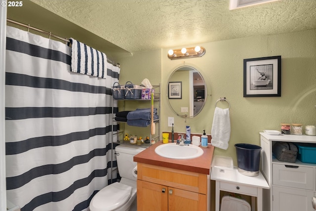 bathroom with a textured ceiling, visible vents, toilet, vanity, and a textured wall