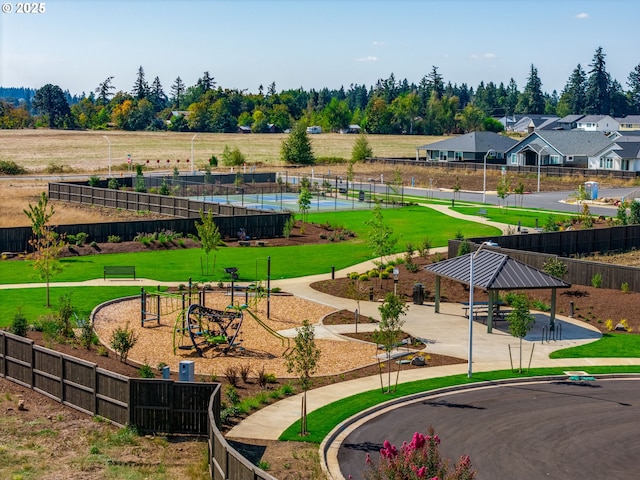 surrounding community with a yard and a gazebo