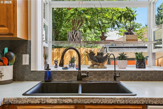 4055 NE 13th Ter, Gresham, OR 97030 - kitchen view of a sink, brown cabinetry, and light countertops