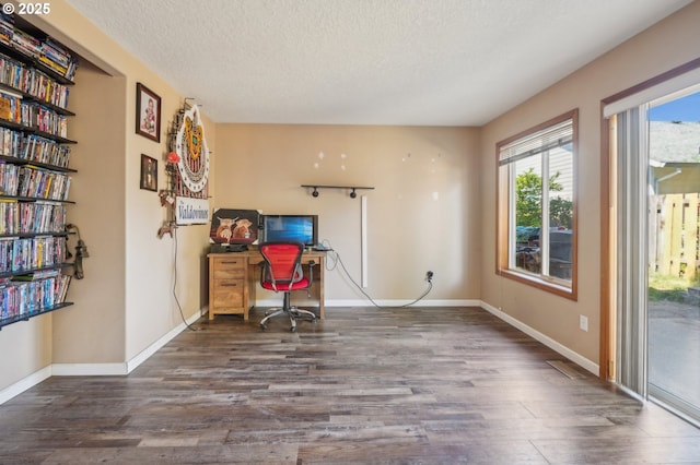 4055 NE 13th Ter, Gresham, OR 97030 - unfurnished office with wood finished floors, a textured ceiling, and baseboards