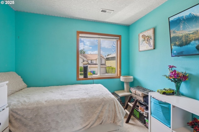 4055 NE 13th Ter, Gresham, OR 97030 - carpeted bedroom with a textured ceiling