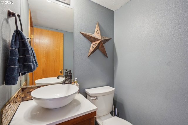 4055 NE 13th Ter, Gresham, OR 97030 - bathroom with a textured wall, vanity, and toilet