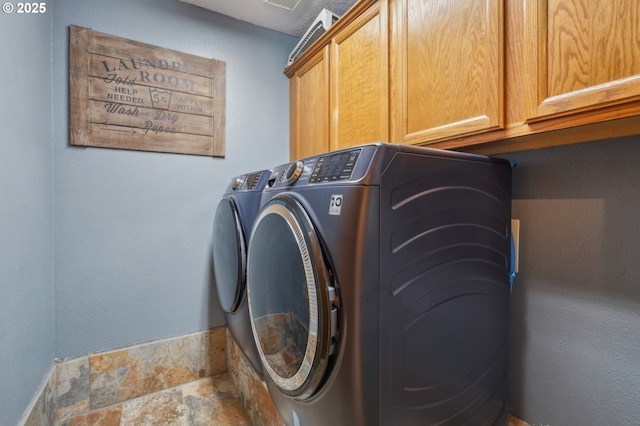 4055 NE 13th Ter, Gresham, OR 97030 - washroom featuring cabinet space, independent washer and dryer, and stone finish flooring