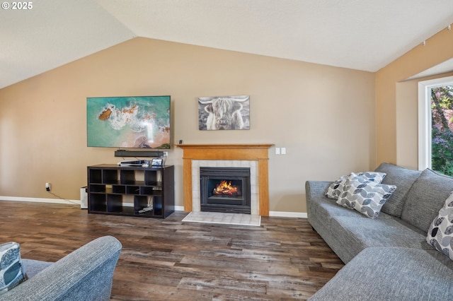 4055 NE 13th Ter, Gresham, OR 97030 - living area featuring wood finished floors, lofted ceiling, a tile fireplace, and baseboards