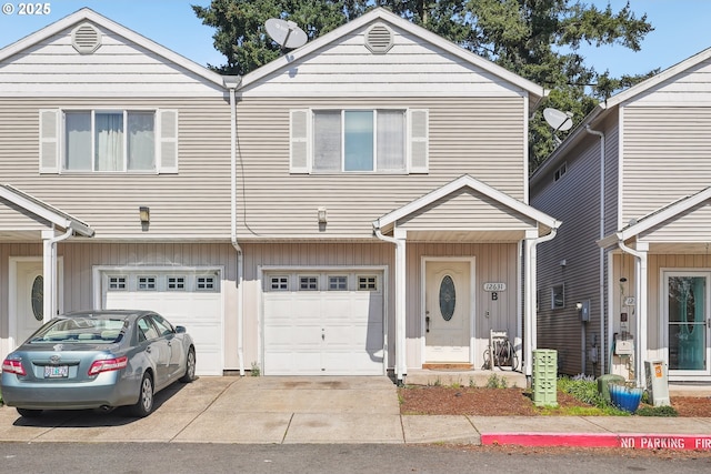12631 SE Division St, Portland, OR 97236 - townhome / multi-family property featuring board and batten siding, an attached garage, and concrete driveway