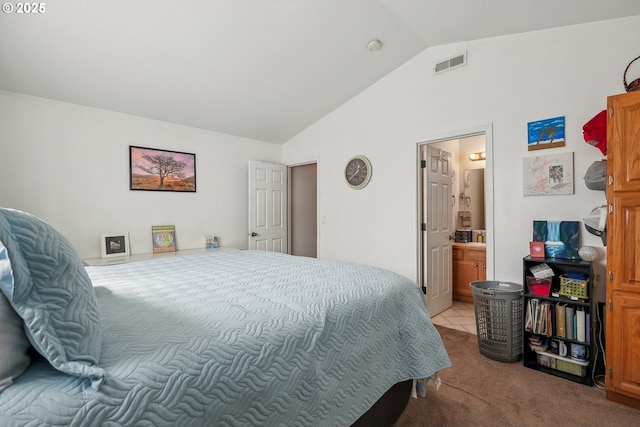 12631 SE Division St, Portland, OR 97236 - bedroom with visible vents, carpet flooring, ensuite bath, and vaulted ceiling