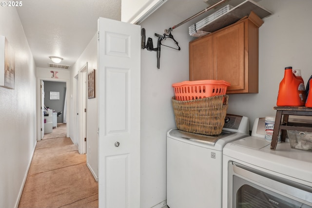 12631 SE Division St, Portland, OR 97236 - laundry area featuring separate washer and dryer, baseboards, light carpet, visible vents, and cabinet space