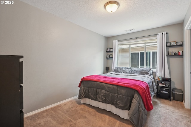 12631 SE Division St, Portland, OR 97236 - bedroom featuring visible vents, a textured ceiling, baseboards, and carpet floors