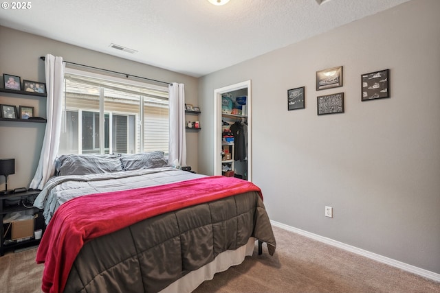 12631 SE Division St, Portland, OR 97236 - carpeted bedroom featuring a textured ceiling, a closet, a spacious closet, visible vents, and baseboards