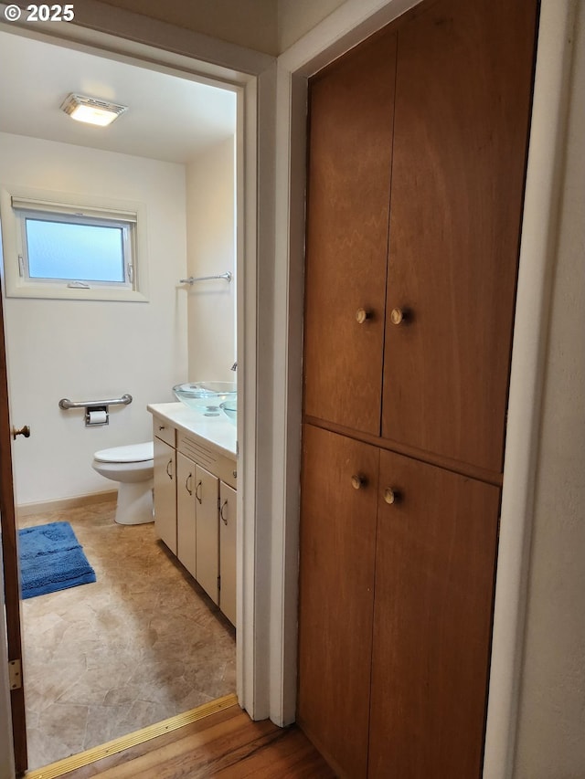 bathroom with vanity and toilet