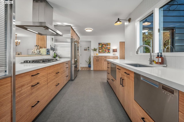 2631 SW Sherwood Dr, Portland, OR 97201 - kitchen featuring modern cabinets, appliances with stainless steel finishes, island exhaust hood, light countertops, and a sink