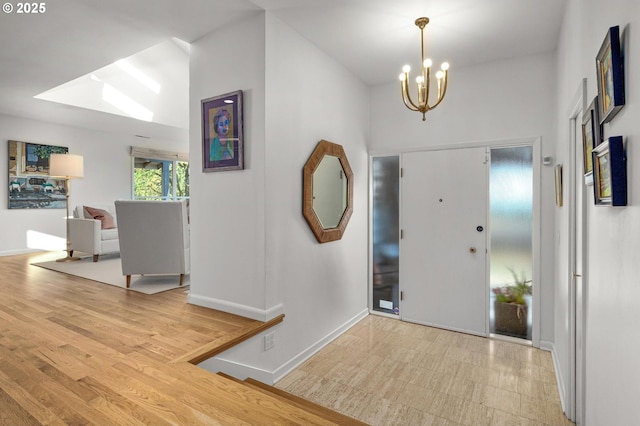 2631 SW Sherwood Dr, Portland, OR 97201 - foyer with baseboards and a chandelier