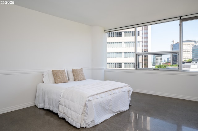 1500 SW 5th Ave Unit 703, Portland, OR 97201 - bedroom featuring baseboards, multiple windows, and a view of city