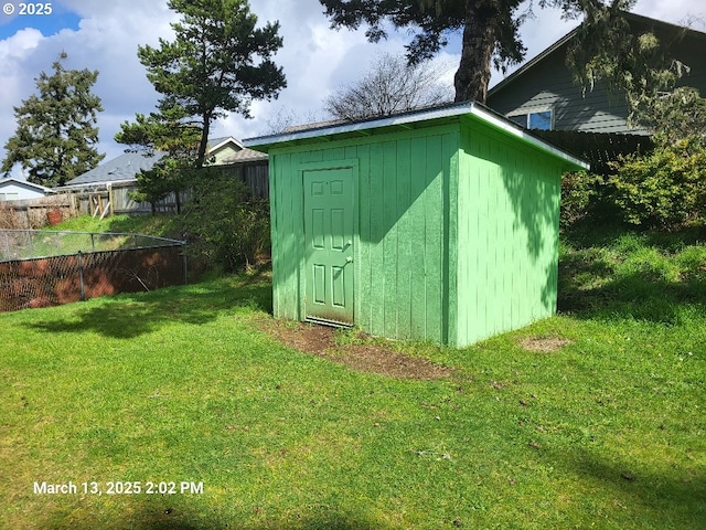 view of shed with fence
