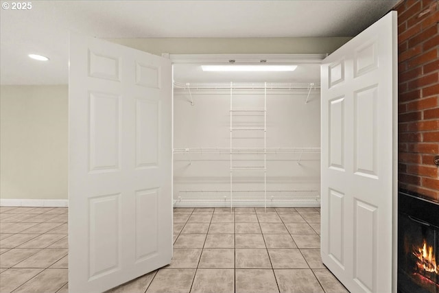 620 Sky Ln, Forest Grove, OR 97116 - walk in closet with light tile patterned flooring and a large fireplace