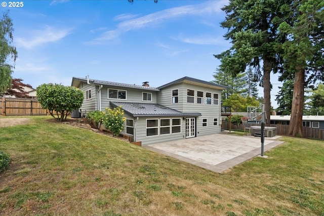 620 Sky Ln, Forest Grove, OR 97116 - rear view of house featuring a fenced backyard, a patio area, and a chimney
