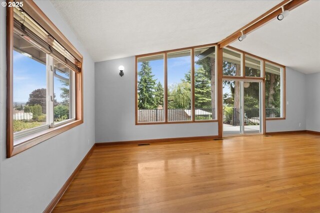 620 Sky Ln, Forest Grove, OR 97116 - unfurnished room featuring lofted ceiling and light wood-style floors