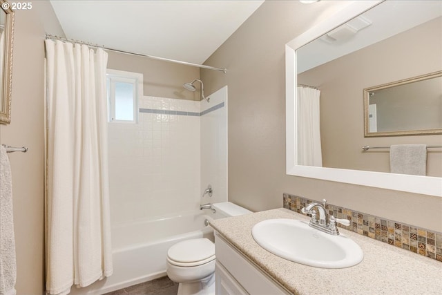 full bath featuring shower / bath combination with curtain, toilet, and vanity