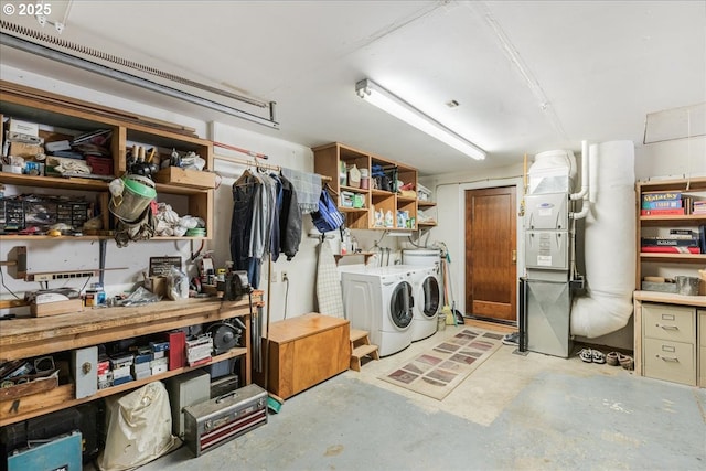 interior space with a workshop area and washing machine and clothes dryer