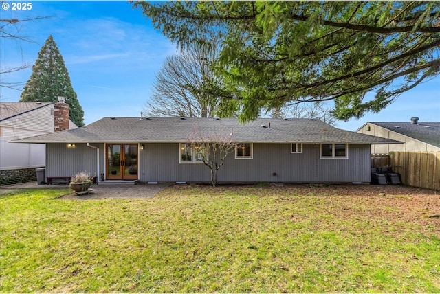 back of house with a patio area, a lawn, and fence