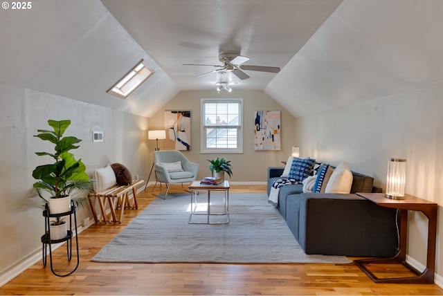 7067 N Dwight Ave, Portland, OR 97203 - living room with wood finished floors, a ceiling fan, lofted ceiling, and a skylight