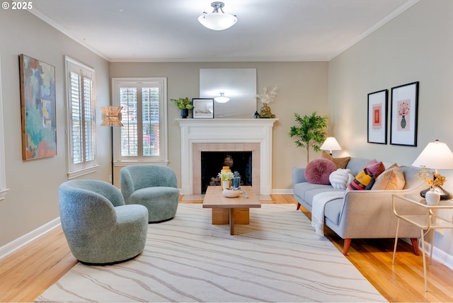 7067 N Dwight Ave, Portland, OR 97203 - living area featuring wood finished floors, ornamental molding, and a tile fireplace