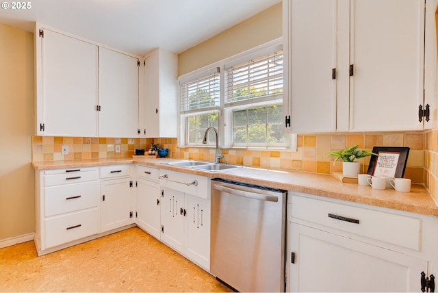 7067 N Dwight Ave, Portland, OR 97203 - kitchen with stainless steel dishwasher, decorative backsplash, white cabinets, and light countertops