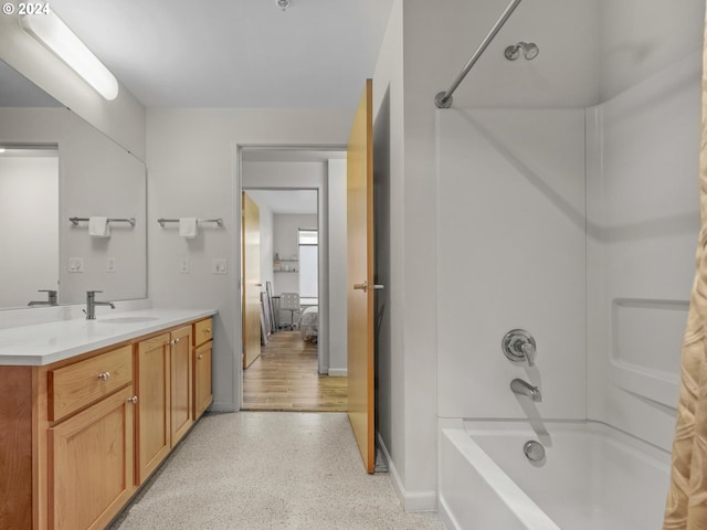 bathroom with vanity and shower / bathing tub combination