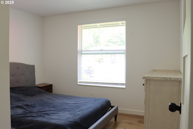 550 NE 20th Dr, Gresham, OR 97030 - bedroom featuring wood finished floors and baseboards