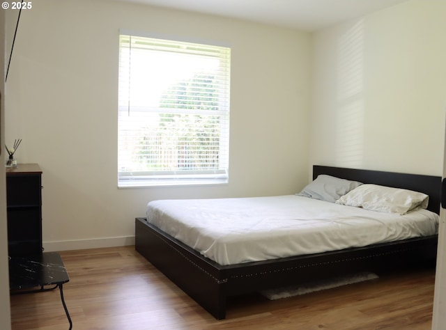 550 NE 20th Dr, Gresham, OR 97030 - bedroom featuring wood finished floors and baseboards