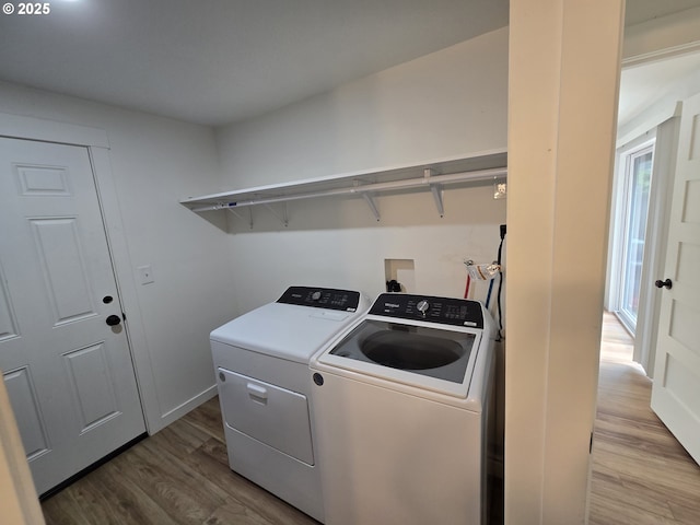 550 NE 20th Dr, Gresham, OR 97030 - laundry area featuring wood finished floors and washer and dryer