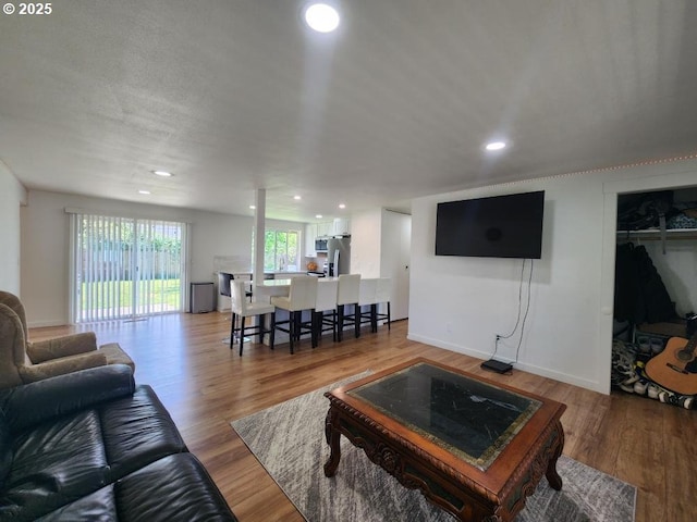 550 NE 20th Dr, Gresham, OR 97030 - living area with recessed lighting, light wood-type flooring, and baseboards