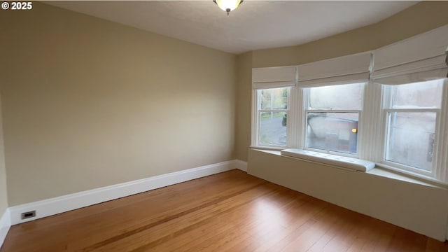 empty room featuring hardwood / wood-style flooring