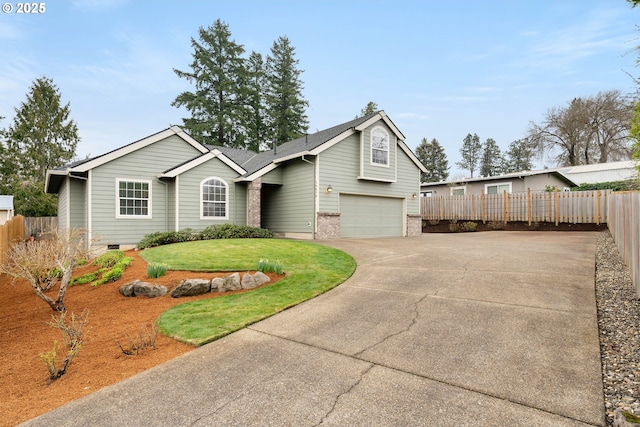 view of front of property featuring brick siding, fence, concrete driveway, a front yard, and an attached garage