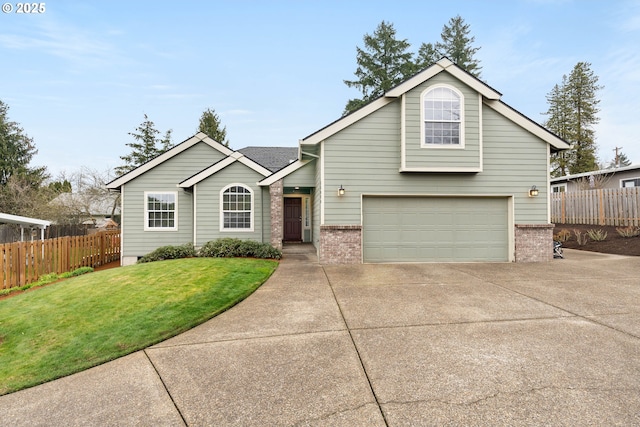 view of front of property featuring a garage, a front lawn, driveway, and fence