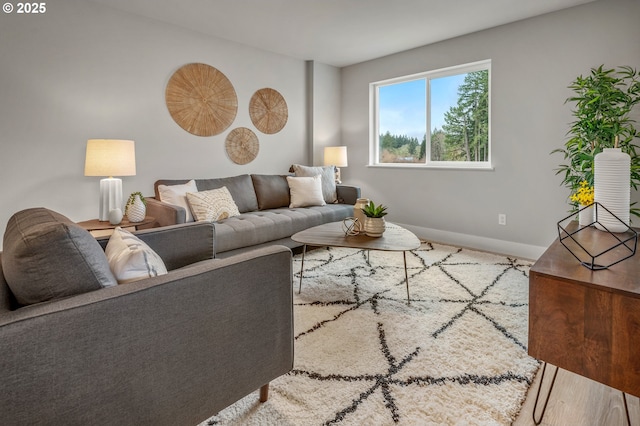 living room with baseboards and carpet flooring