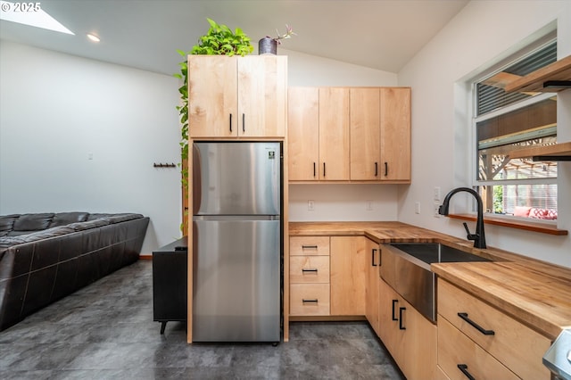 2345 Deady St, Port Orford, OR 97465 - kitchen with freestanding refrigerator, wooden counters, light brown cabinetry, and a sink