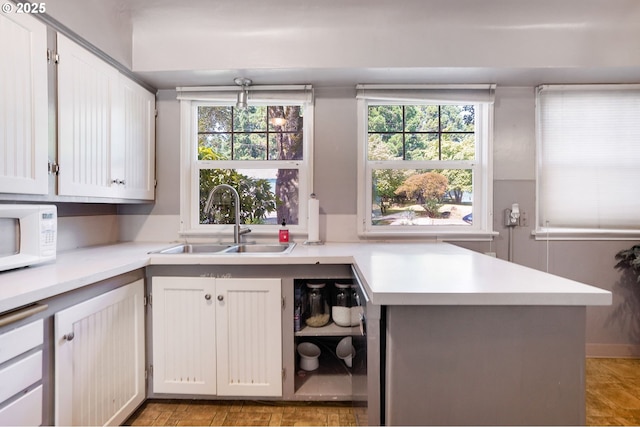 3374 Pioneer Dr, Salem, OR 97302 - kitchen with white microwave, light countertops, and white cabinets